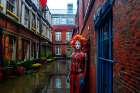 Fantasy of blue woman in an English courtyard. AI Generated. Art Print